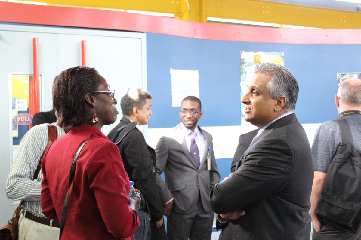 Dr. Maraj conversing with a participant of the ADAPT conference.