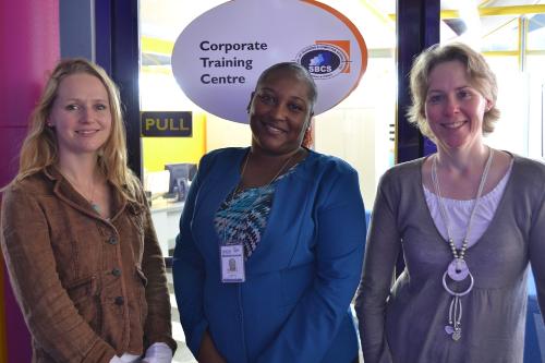 from left to right - Ms. Gemma Gwynne-Stevenson, EBS Quality Manager, Ms. Selina Lewis, Supervisor of Academic and Administrative Support and Ms. Sally Mac Leod at the entrance to our Corporate Training Centre Department