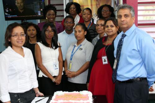  POS Campus staff poses with Executive Director, Dr. Robin Maraj