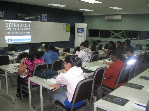 Guests review materials before the presentation 